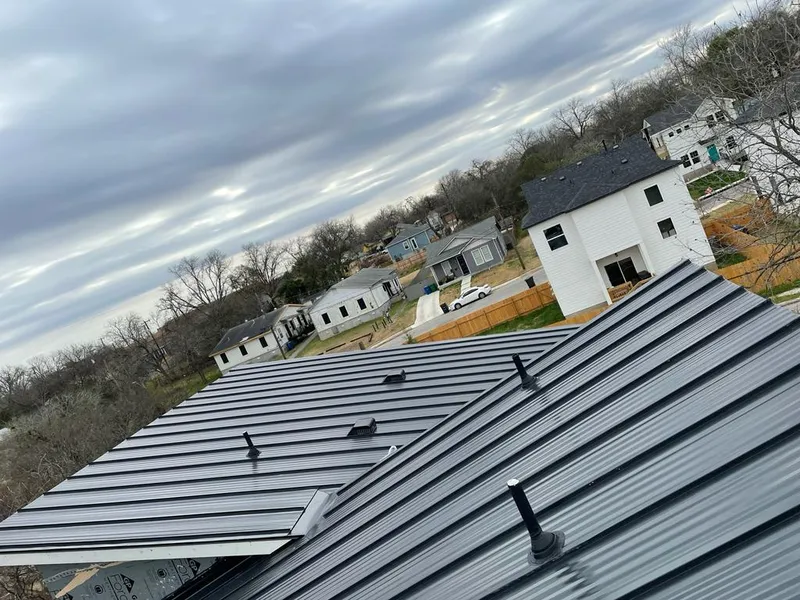 Standing seam metal roof panels with vents for Skylight Repair in East Moline